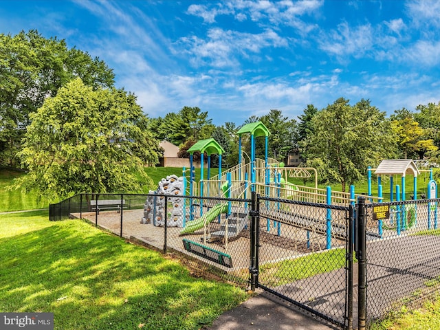 community playground with fence and a yard