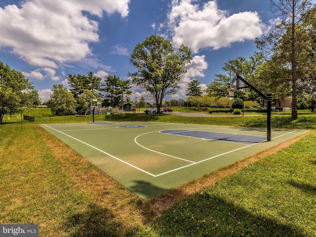 view of basketball court with a yard and community basketball court