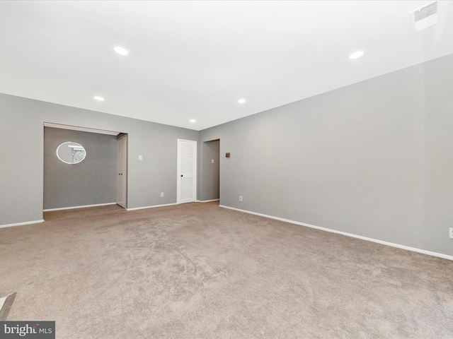 unfurnished living room with baseboards, carpet flooring, visible vents, and recessed lighting