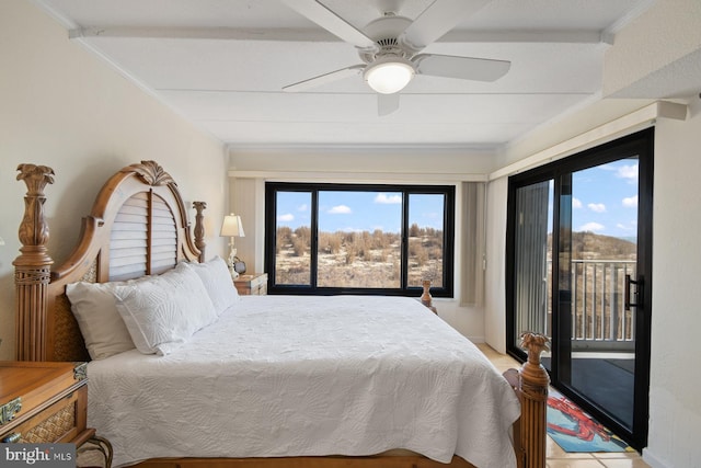 bedroom featuring access to exterior, multiple windows, and a ceiling fan