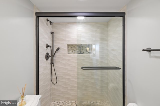 bathroom featuring a shower stall