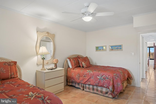 bedroom with a ceiling fan, light tile patterned flooring, and crown molding