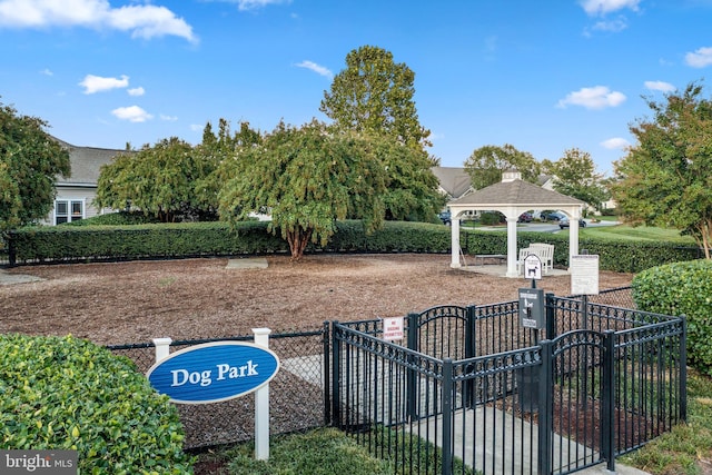 view of property's community featuring fence and a gazebo