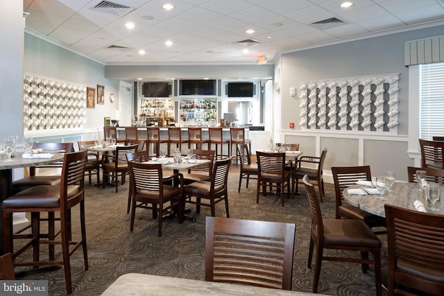 dining area with recessed lighting, visible vents, and crown molding