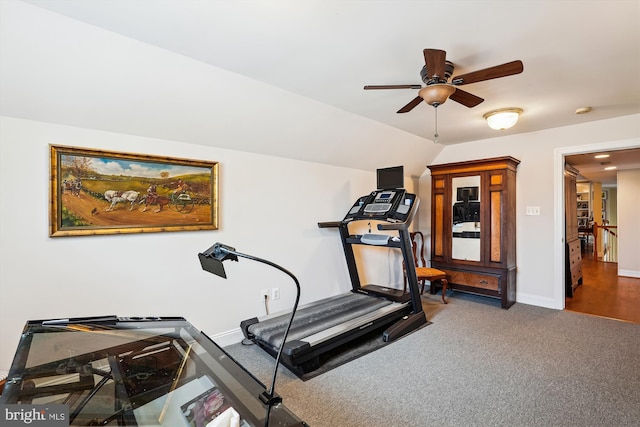 exercise area with a ceiling fan, baseboards, and carpet