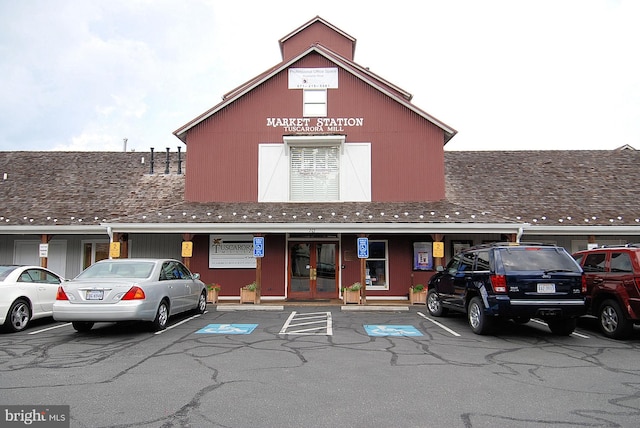 view of building exterior with uncovered parking