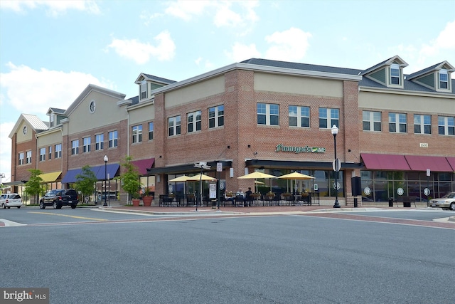 view of property featuring uncovered parking