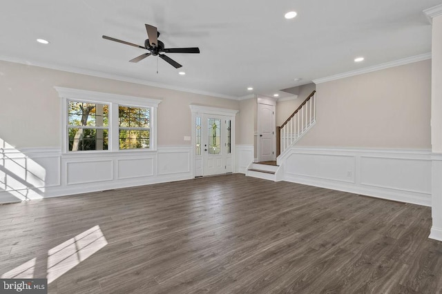 unfurnished living room featuring crown molding, stairs, dark wood-type flooring, and recessed lighting