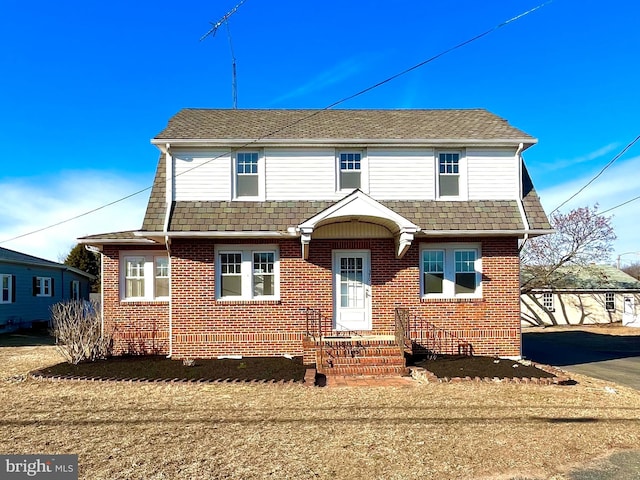 view of front of house with brick siding