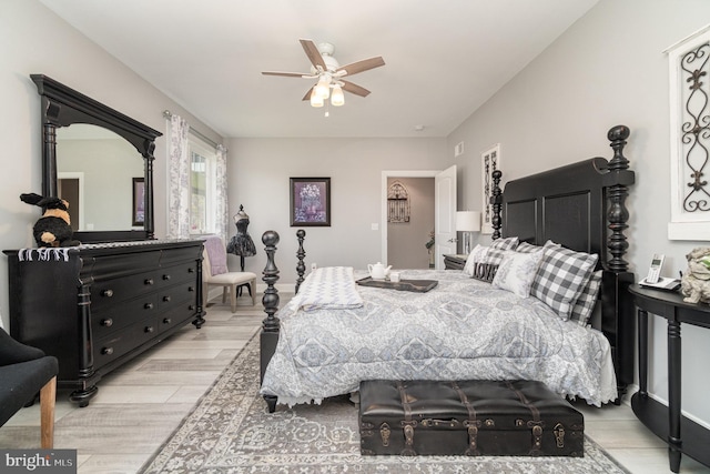 bedroom featuring light wood-style flooring and ceiling fan