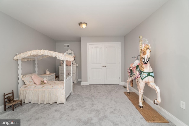 bedroom featuring baseboards, a closet, visible vents, and light colored carpet