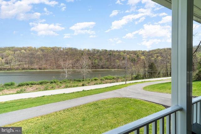 property view of water featuring a forest view