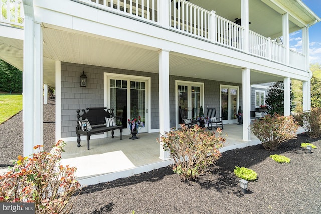 view of patio / terrace with covered porch and a balcony