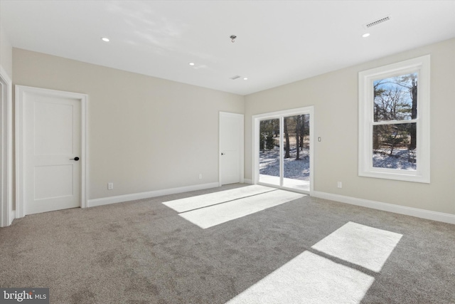 unfurnished room featuring recessed lighting, visible vents, light carpet, and baseboards