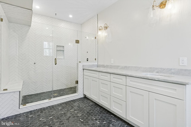 full bathroom featuring a stall shower, a sink, recessed lighting, and double vanity