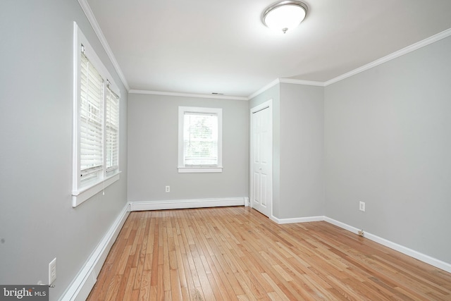 508 Garden Way, Mount Laurel, NJ 08054 - unfurnished room with a baseboard heating unit, light wood-style flooring, baseboards, and ornamental molding
