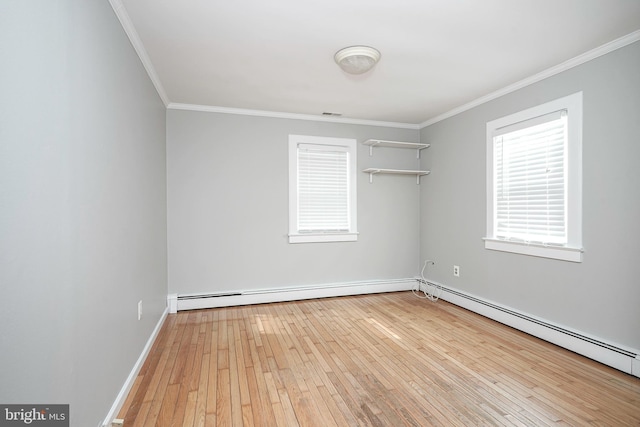 508 Garden Way, Mount Laurel, NJ 08054 - spare room featuring a baseboard heating unit, hardwood / wood-style flooring, and crown molding