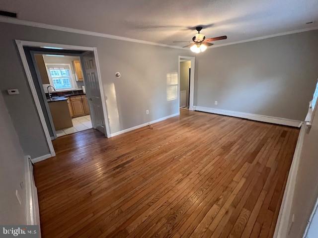 508 Garden Way, Mount Laurel, NJ 08054 - unfurnished bedroom with baseboards, a sink, light wood-style floors, and ornamental molding