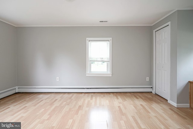 508 Garden Way, Mount Laurel, NJ 08054 - spare room featuring visible vents, light wood-type flooring, crown molding, baseboards, and a baseboard radiator