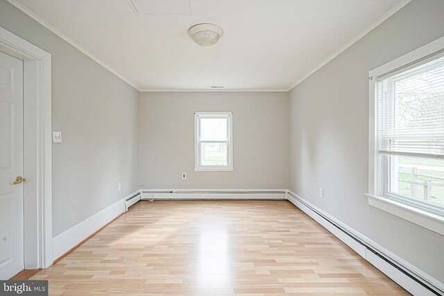 508 Garden Way, Mount Laurel, NJ 08054 - empty room with a baseboard heating unit, baseboards, crown molding, and light wood-style floors