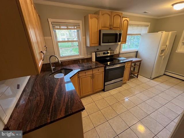 508 Garden Way, Mount Laurel, NJ 08054 - kitchen with light tile patterned floors, crown molding, stainless steel appliances, and a sink
