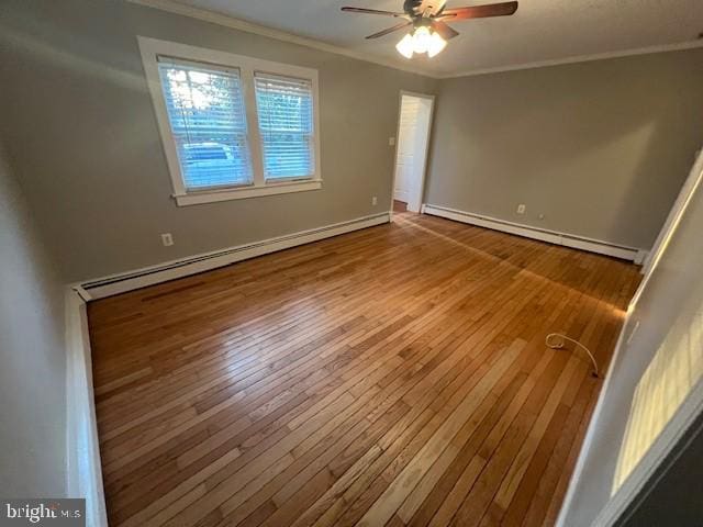508 Garden Way, Mount Laurel, NJ 08054 - unfurnished room with a baseboard radiator, crown molding, hardwood / wood-style floors, and ceiling fan