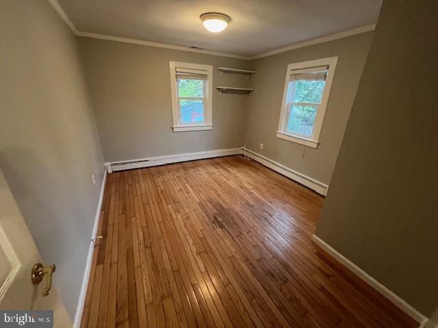 508 Garden Way, Mount Laurel, NJ 08054 - spare room featuring plenty of natural light, hardwood / wood-style flooring, baseboards, and crown molding