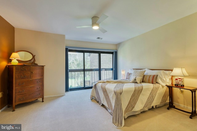 bedroom with visible vents, carpet floors, a ceiling fan, and access to outside