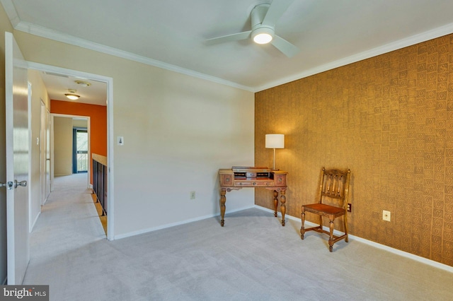 living area featuring wallpapered walls, baseboards, and ornamental molding