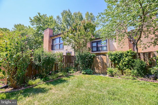 view of yard with a fenced backyard