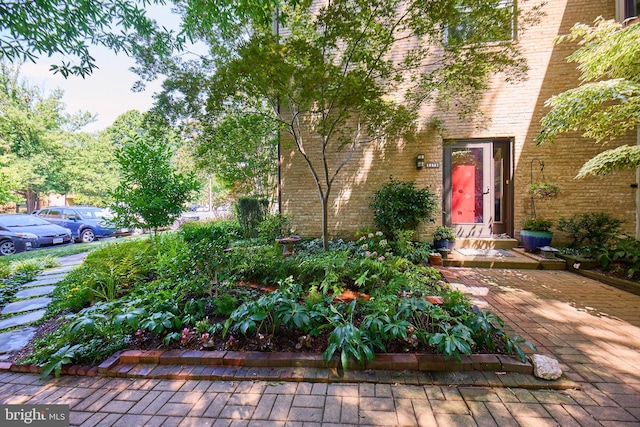 property entrance featuring brick siding