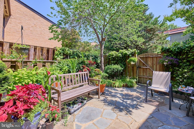 view of patio / terrace featuring a gate and fence