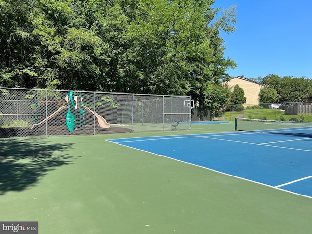 view of sport court with community basketball court and fence