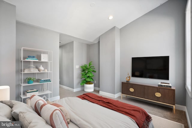 bedroom with lofted ceiling, recessed lighting, baseboards, and light colored carpet