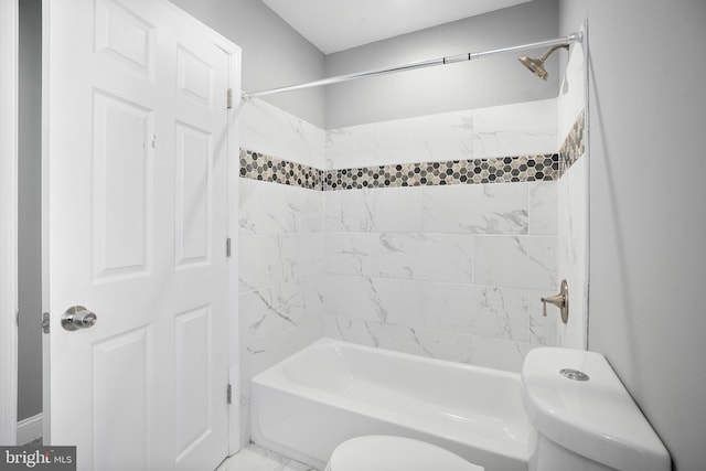 bathroom featuring marble finish floor, toilet, and shower / bathtub combination