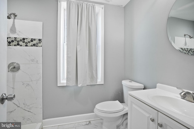 bathroom with baseboards, toilet, marble finish floor, walk in shower, and vanity