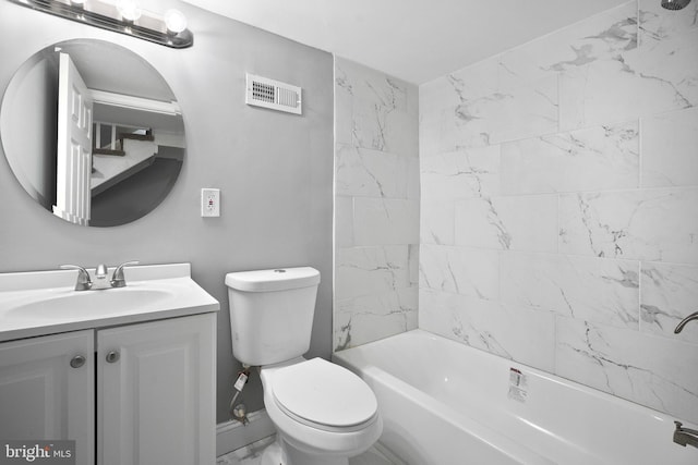 bathroom with toilet, tub / shower combination, vanity, and visible vents