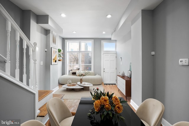 living room featuring visible vents, stairs, baseboards, and recessed lighting