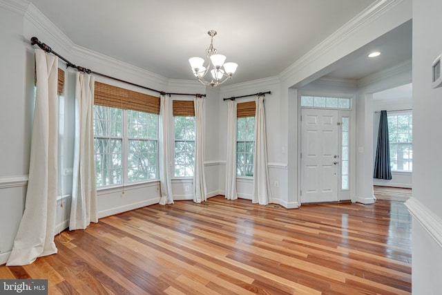 16309 Sandy Ridge Ct, Woodbridge, VA 22191 - entryway with a chandelier, light wood-style floors, healthy amount of natural light, and ornamental molding