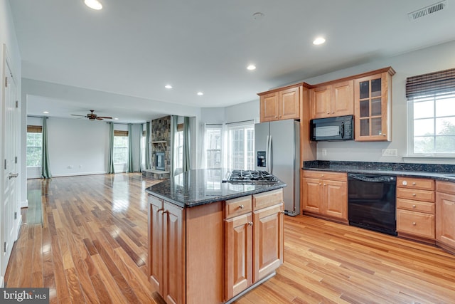 16309 Sandy Ridge Ct, Woodbridge, VA 22191 - kitchen with black appliances, light wood finished floors, recessed lighting, plenty of natural light, and open floor plan