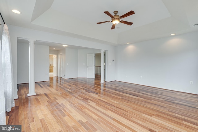 16309 Sandy Ridge Ct, Woodbridge, VA 22191 - spare room with a raised ceiling, ceiling fan, ornate columns, light wood-style floors, and recessed lighting