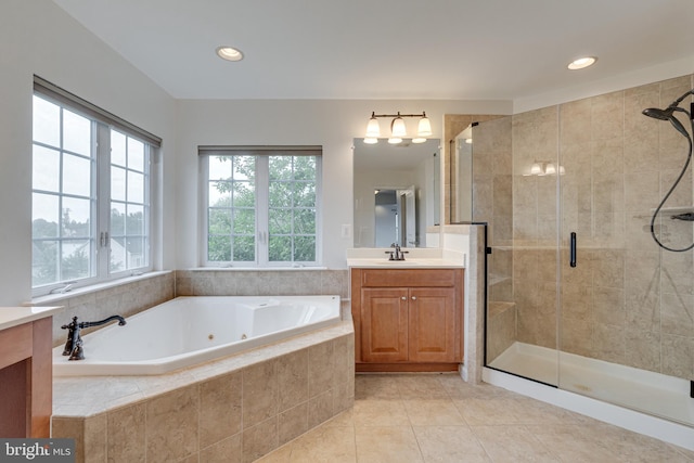 16309 Sandy Ridge Ct, Woodbridge, VA 22191 - bathroom with vanity, a jetted tub, a shower stall, tile patterned floors, and recessed lighting