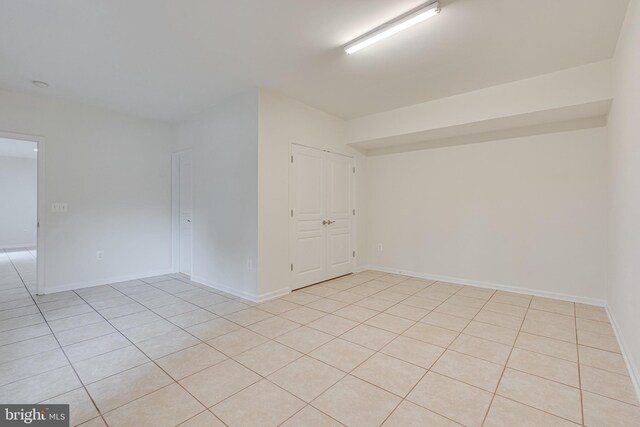 16309 Sandy Ridge Ct, Woodbridge, VA 22191 - spare room with light tile patterned floors and baseboards