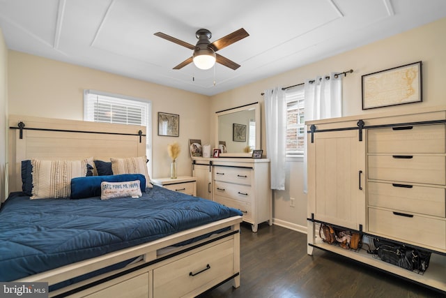 bedroom featuring dark wood-style floors, ceiling fan, and baseboards