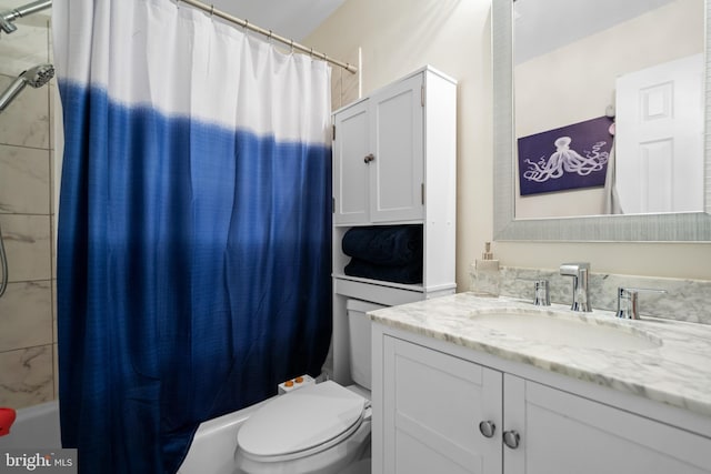 full bath featuring shower / bath combo, vanity, and toilet