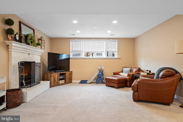 living area featuring a fireplace, recessed lighting, light colored carpet, visible vents, and baseboards