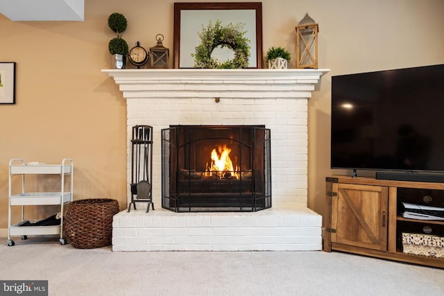 interior details with a fireplace and carpet flooring