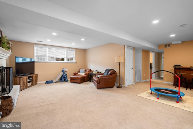 game room with baseboards, visible vents, light colored carpet, a fireplace, and recessed lighting