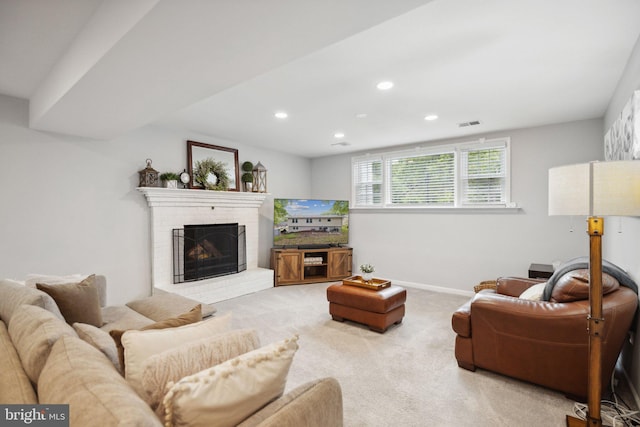 living room with visible vents, baseboards, carpet flooring, a brick fireplace, and recessed lighting