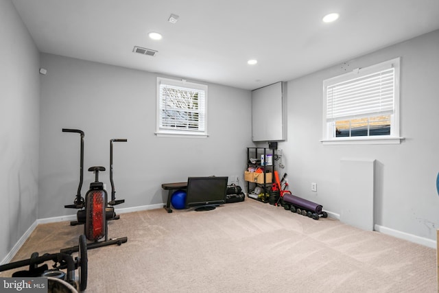 exercise room with baseboards, carpet floors, visible vents, and recessed lighting